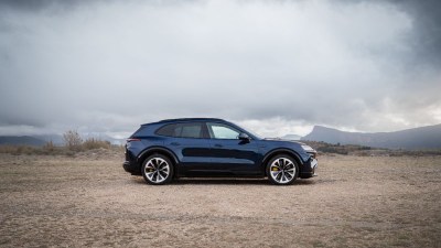 Porsche Cayenne SUV parked on urban street showcasing sleek design and luxury automotive features