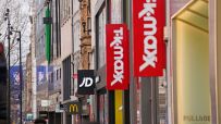 Busy retail store with diverse shoppers browsing aisles, highlighting vibrant displays and bustling atmosphere