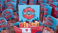 City Beerfest attendees enjoying a sunny day in London with iconic skyline views, organized by City of London Corporation.