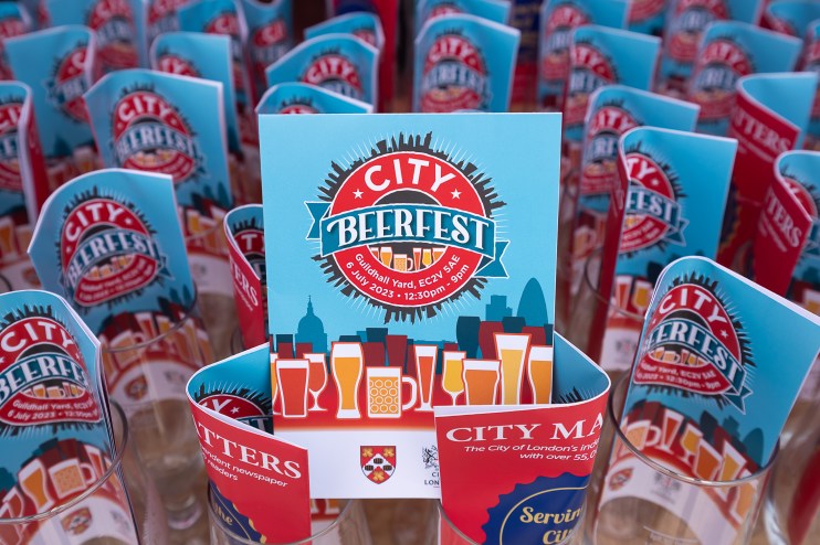 City Beerfest attendees enjoying a sunny day in London with iconic skyline views, organized by City of London Corporation.