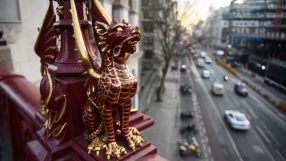 City of London boundary dragon statue symbolizing economic uncertainty amidst political instability