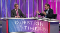 Nigel Farage and Suella Braverman in discussion at a political event wearing formal attire, highlighting political collabo...