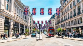 Bustling Regent Street showcasing vibrant storefronts and diverse pedestrians, capturing the essence of urban life.