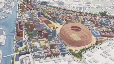 Architectural model of a city development featuring a large stadium, buildings, and waterways by Allies and Morrison
