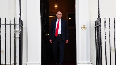 Chancellor John Healey speaking at a professional event, likely a press conference or address.
