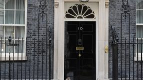 Number 10 Downing Street entrance with iconic black door, symbolizing British political power and leadership