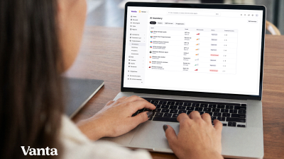 Person using a Vanta AI Inventory dashboard on a laptop to manage AI agents and their risk.