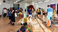 Visitors at the Square Mile art gallery viewing diverse contemporary artworks and sculptures.
