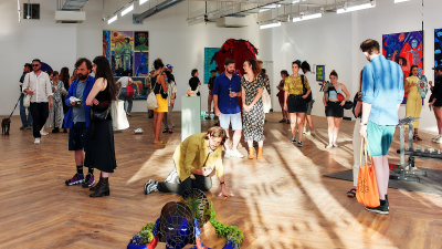 Visitors at the Square Mile art gallery viewing diverse contemporary artworks and sculptures.