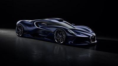 Dark blue Bugatti Solitaire Destrier hypercar with sleek design and silver trim, against a black background