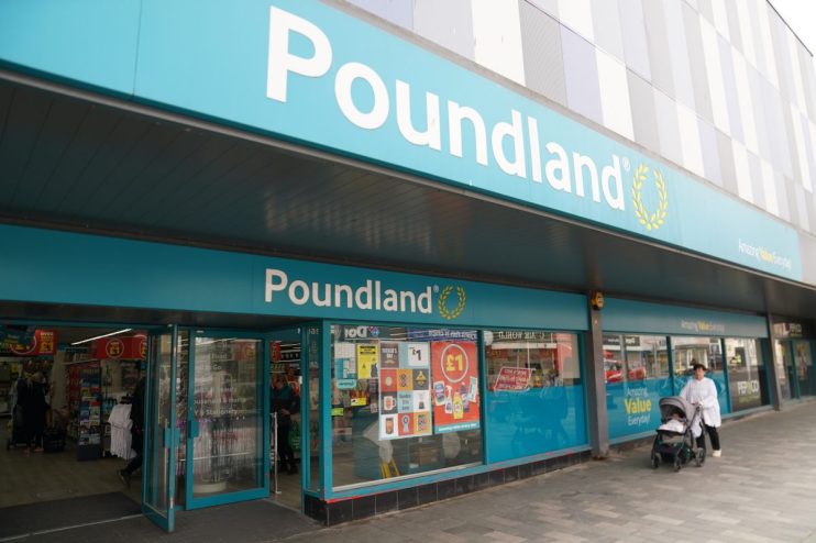 Exterior view of a Poundland store entrance with its teal blue signage and glass doors