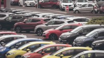 Rows of new and used cars parked at a dealership lot, ready for sale.