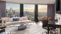 Luxurious one-bedroom suite living room at Artotel London Hoxton with city skyline views.