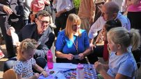 Andy Burnham and Angela Rayner interacting with children at an outdoor event