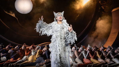 Grizabella in a shaggy white costume with cat ears, performing Memory from Cats musical at Regents Park Open Air Theatre