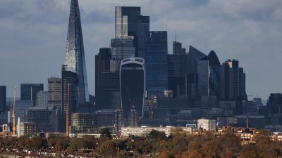 London skyline with The Shard, Walkie Talkie, and Gherkin skyscrapers towering over residential buildings and autumn trees.