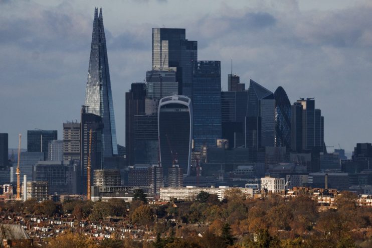 London skyline with The Shard, Walkie Talkie, and Gherkin skyscrapers towering over residential buildings and autumn trees.