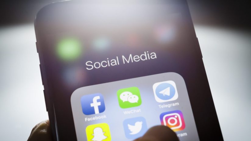 Smartphone screen displaying Social Media folder with Facebook, WeChat, Telegram, Twitter, Instagram, and Snapchat app icons.
