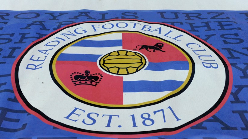 Reading Football Club crest on a blue and white banner, with EST. 1871 visible.
