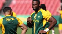 Siya Kolisi, Springboks captain, in a green and gold rugby jersey during a match