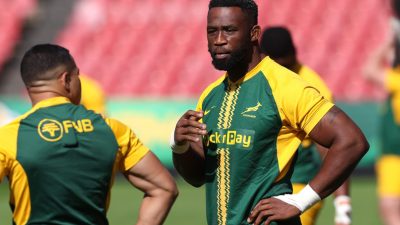 Siya Kolisi, Springboks captain, in a green and gold rugby jersey during a match