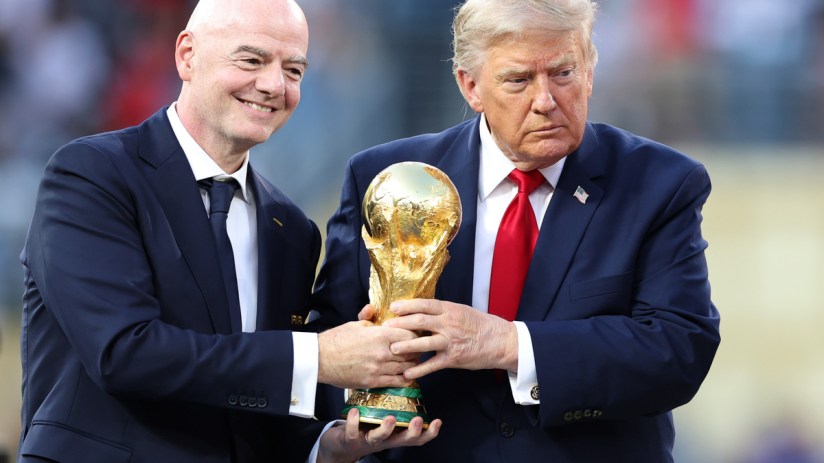 Gianni Infantino and Donald Trump holding the FIFA World Cup trophy