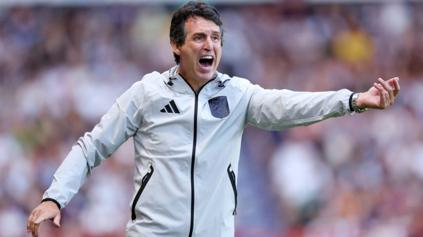 Unai Emery, Aston Villa manager, shouts with intensity during a football match, gesturing with his right arm.