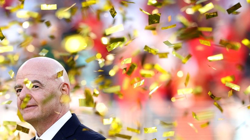 Gianni Infantino, FIFA President, smiling as golden confetti falls around him