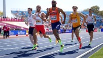 Runners from Great Britain, France, Netherlands, Germany, and Italy competing in a track event.