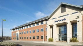 Harworth Group building exterior with a brick facade and prominent entrance under a blue sky