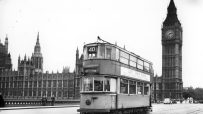 London tram 1925 with Last Tram Week sign in front of the Houses of Parliament and Big Ben, 1952.