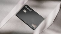 Revolut Mastercard debit card in black with textured lines on a light gray surface