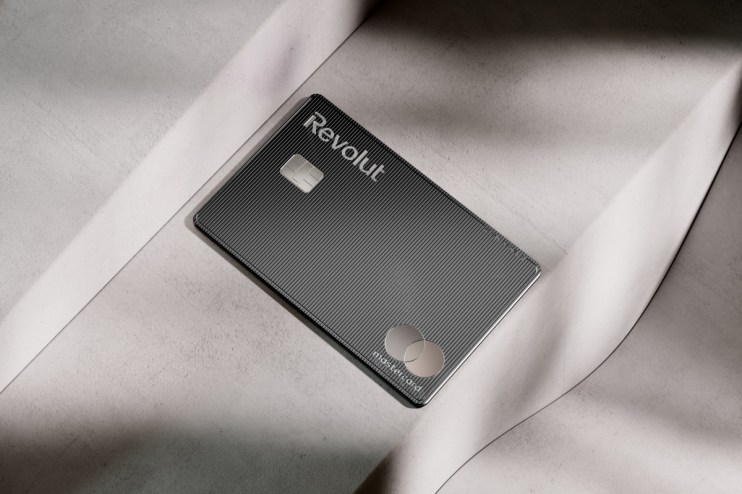 Revolut Mastercard debit card in black with textured lines on a light gray surface