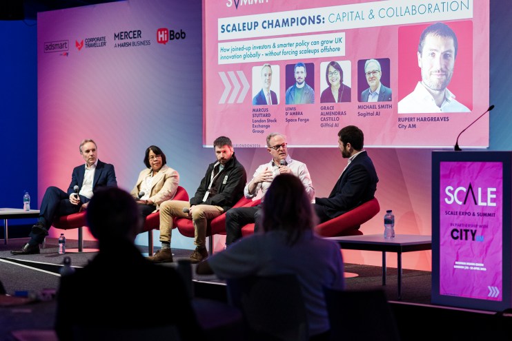 Panelists discuss Scaleup Champions: Capital & Collaboration at SCALEEXPOSUMMIT, with sponsor logos visible.