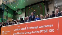 Confetti falls as executives celebrate Lion Finance Group joining the FTSE 100 at the London Stock Exchange.