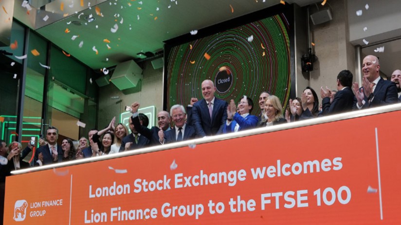 Confetti falls as executives celebrate Lion Finance Group joining the FTSE 100 at the London Stock Exchange.