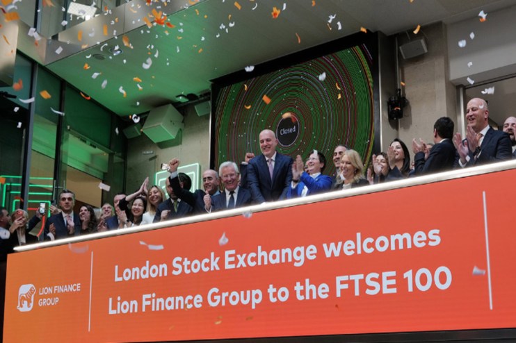 Confetti falls as executives celebrate Lion Finance Group joining the FTSE 100 at the London Stock Exchange.