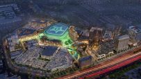 Aerial night rendering of a glowing Dallas Stars NHL arena surrounded by mixed-use buildings, roads, and homes.