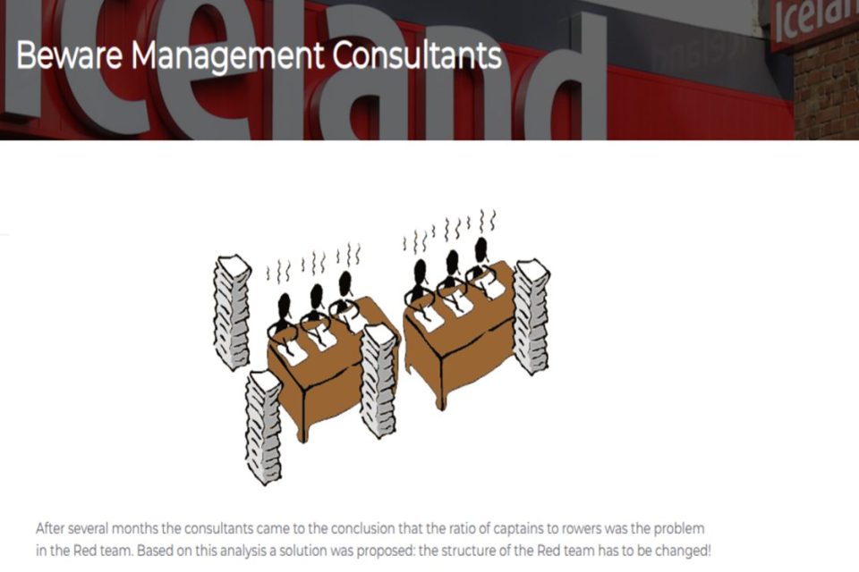 Illustration of four business people at two desks, overwhelmed by piles of paperwork, with Iceland logo in background.