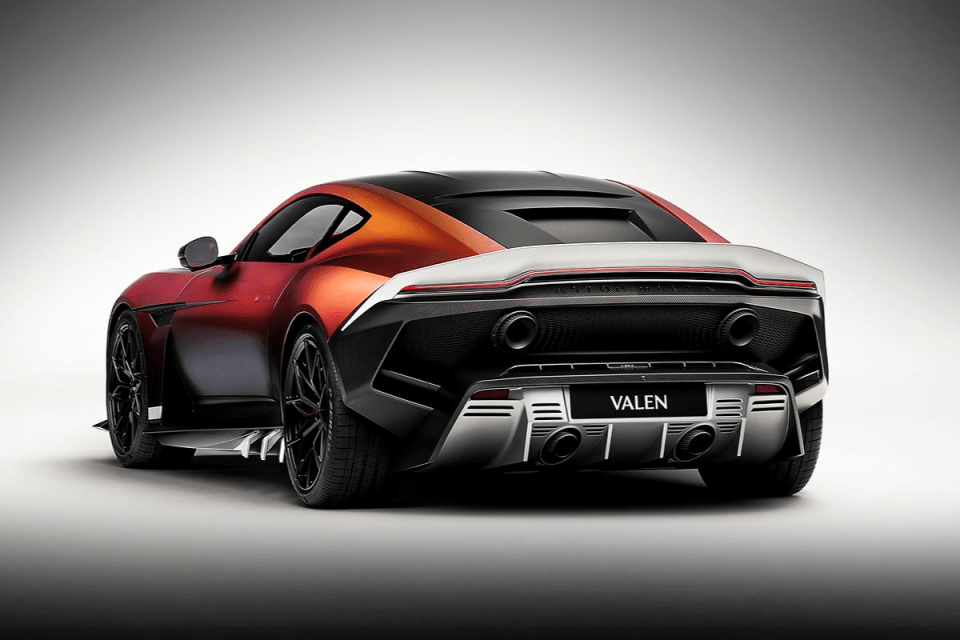 Rear view of a sleek, modern sports car with a gradient red-orange to dark red paint job and VALEN on the license plate