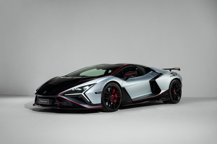 Lamborghini Revuelto SV, a sleek silver and black supercar with red accents, front 3/4 view.