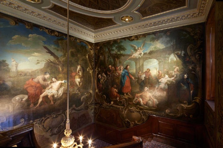 Ornate St. Bartholomews Hospital mural, depicting biblical scenes, on a grand staircase with carved wood and gold trim