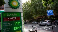 BP petrol station sign showing Londis and Costa Express with regular unleaded at 179.9 and diesel at 204.9. Cars on a Lond...
