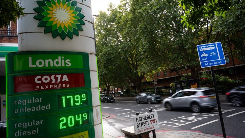 BP petrol station sign showing Londis and Costa Express with regular unleaded at 179.9 and diesel at 204.9. Cars on a Lond...