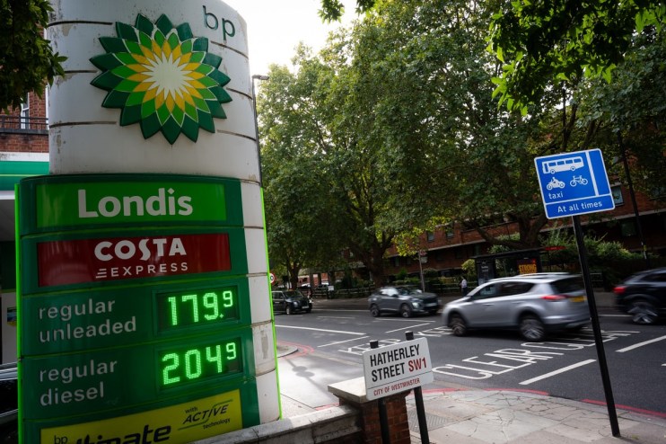 BP petrol station sign showing Londis and Costa Express with regular unleaded at 179.9 and diesel at 204.9. Cars on a Lond...