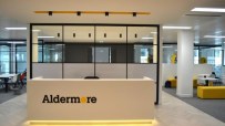 Aldermore Bank reception desk with yellow accents in a modern office interior