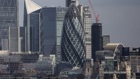London skyline with the Gherkin skyscraper, other modern buildings, and a glimpse of Tower Bridge