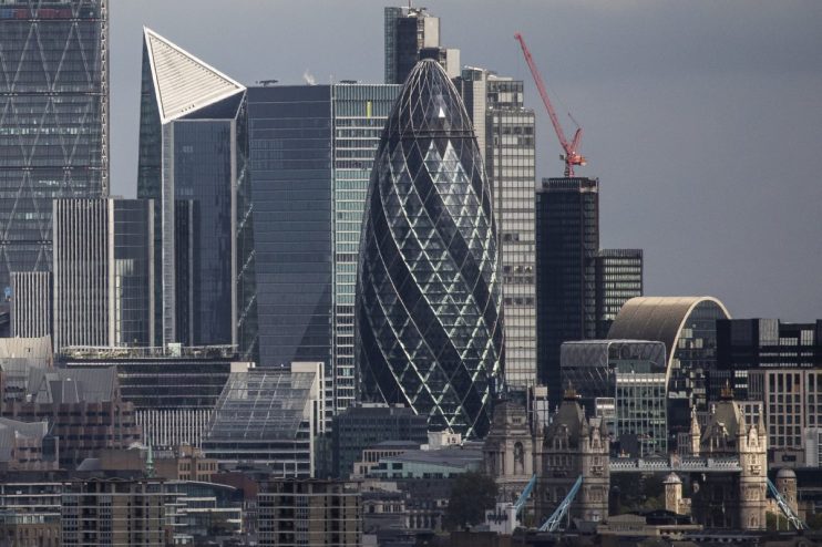 London skyline with the Gherkin skyscraper, other modern buildings, and a glimpse of Tower Bridge