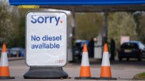 Tesco sign states Sorry. No diesel available at a petrol station with orange traffic cones