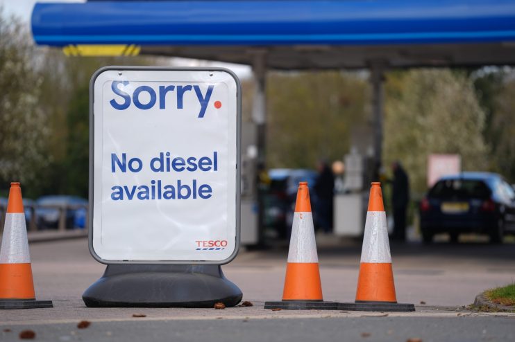 Tesco sign states Sorry. No diesel available at a petrol station with orange traffic cones